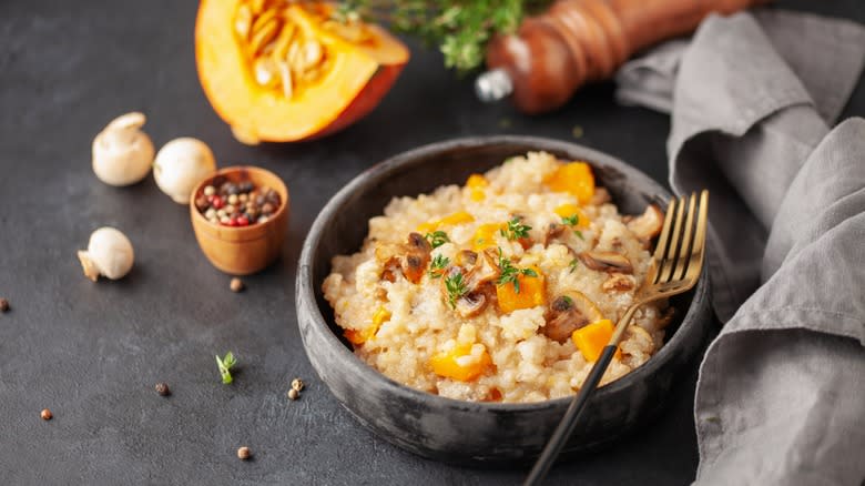 pumpkin risotto in dark bowl 