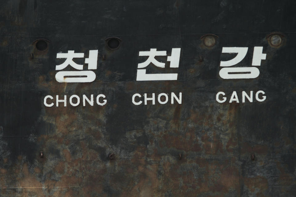 The name of the North Korean ship Chong Chon Gang covers the side of the ship anchored in Sherman Bay near Colon City, Panama, Wednesday, Feb. 12, 2014. Panama Canal officials say the North Korean ship seized as it was smuggling weapons is free to leave because the owner has paid a fine. Three of the vessel's operators still face charges, while 32 crew members are free to return to North Korea. (AP Photo/Arnulfo Franco)