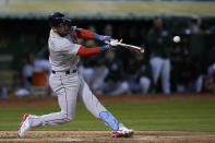 Boston Red Sox's Trevor Story hits an two-run double against the Oakland Athletics during the third inning of a baseball game Monday, April 1, 2024, in Oakland, Calif. (AP Photo/Godofredo A. Vásquez)