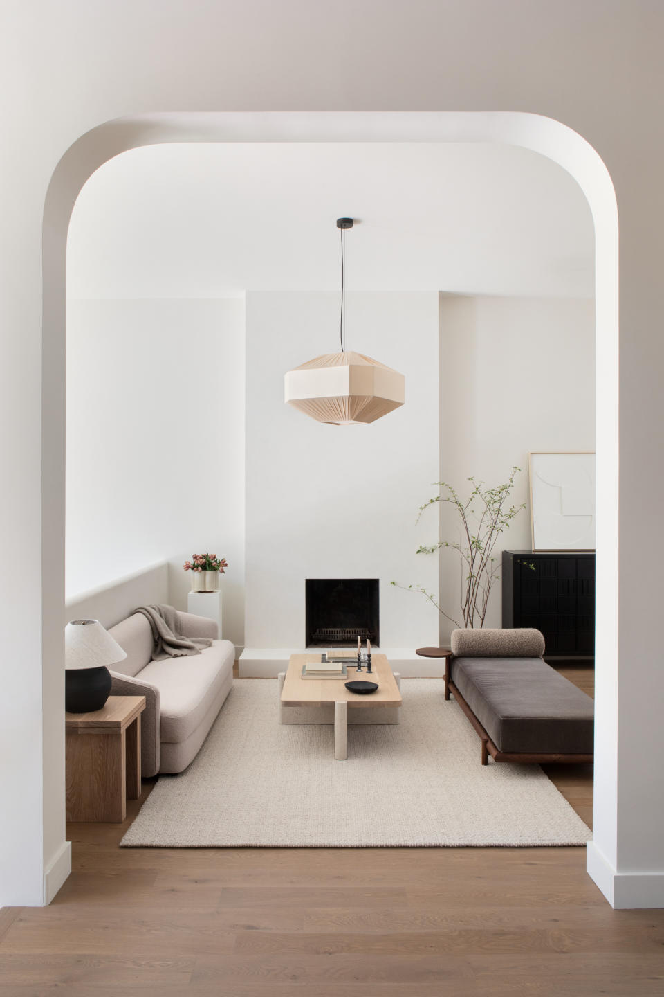 A cozy minimalist living room with area rug