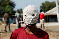 <p>A demonstrator supporting opposition leader Raila Odinga wears a mask as he protests, after Odinga claimed “massive” fraud in this week’s elections, in Kisumu, Kenya , Aug. 9, 2017. (Photo: Baz Ratner/Reuters) </p>