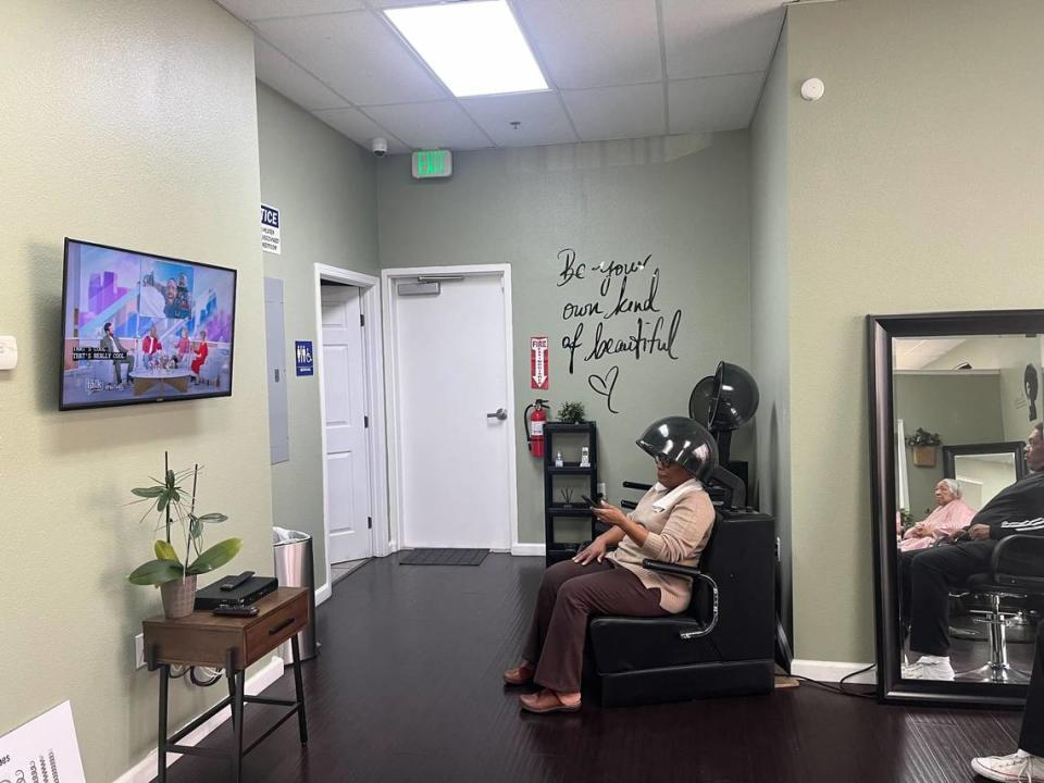 A woman sitting in a chair gets her hair blow dried at A Beautiful You Hair Salon in Elk Grove.