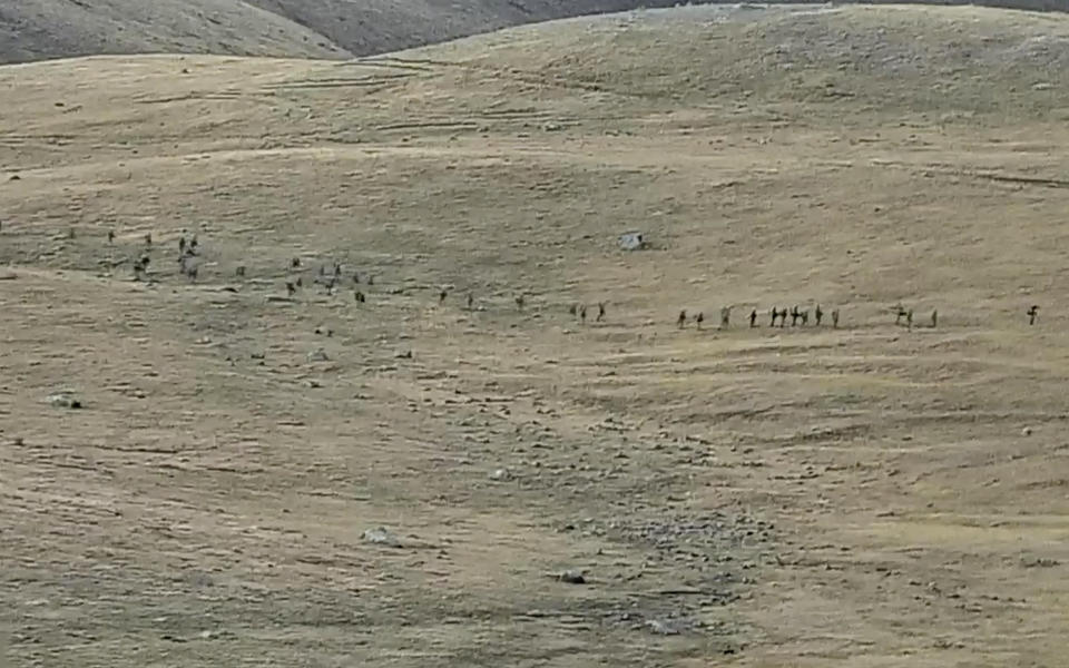 This image taken from a YouTube footage released by Armenian Defense Ministry on Tuesday, Sept. 13, 2022, shows Azerbaijanian servicemen crossing the Armenian-Azerbaijani border and approaching the Armenian positions. Armenia's prime minister says that 49 soldiers have been killed in nighttime attacks by Azerbaijan. (Armenian Defense Ministry via AP)