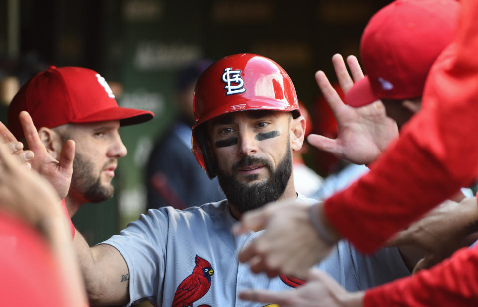 St. Louis Cardinals' Matt Carpenter (13) celebrates in the dugout scoring in the fourth inning of a baseball game against the Chicago Cubs on Saturday, Sept. 29, 2018, in Chicago. (AP Photo/Matt Marton)