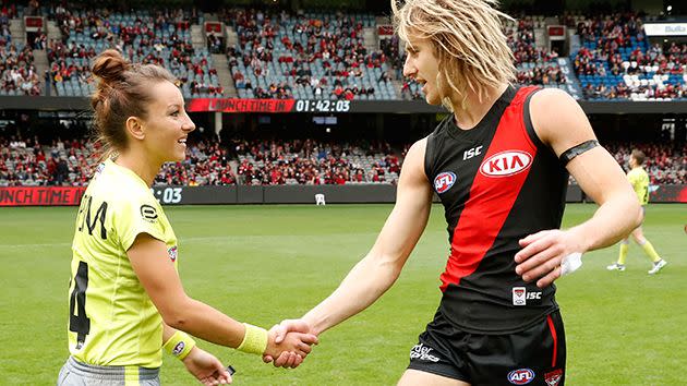 Glouftsis shakes hands with Bomber Dyson Heppell. Picture: Getty