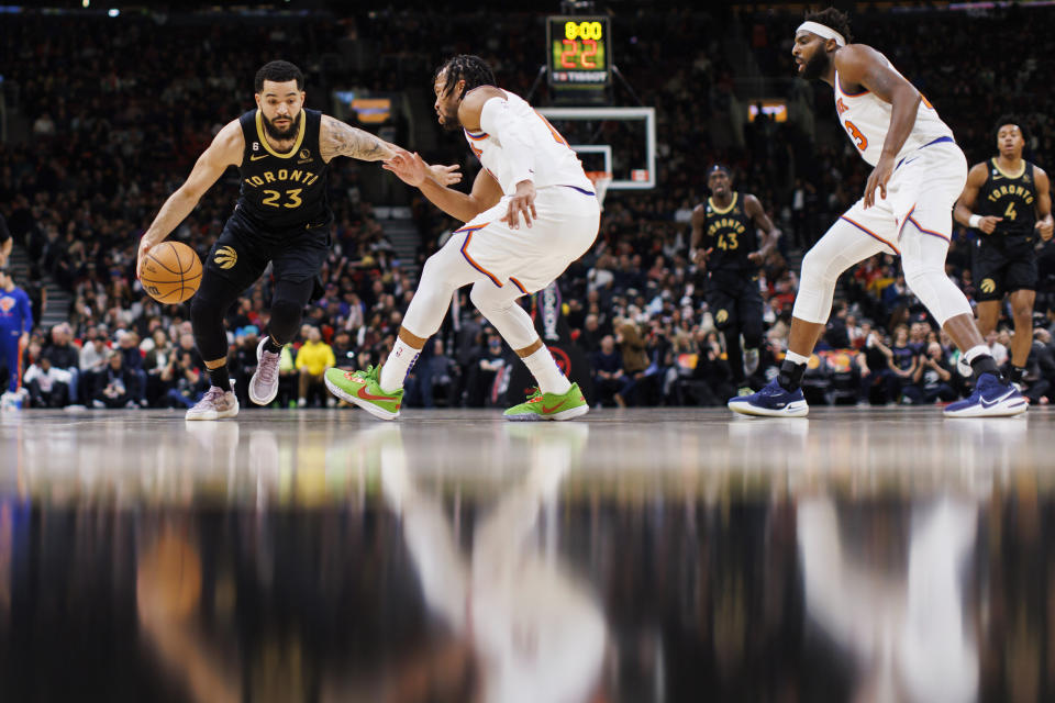 Toronto Raptors guard Fred VanVleet (23) is defended by New York Knicks guard Jalen Brunson, middle, during the first half of an NBA basketball game Friday, Jan. 6, 2023, in Toronto. (Cole Burston/The Canadian Press via AP)