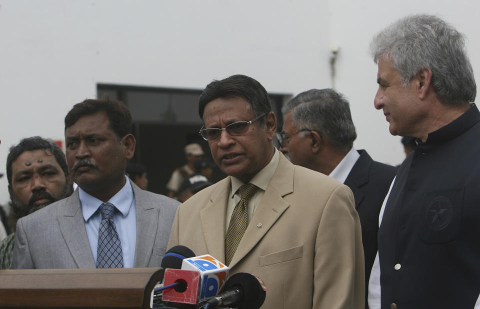 Honorary Secretary General of the Sri Lankan Cricket Board Mohan De Silva, center, speaks to journalists at the National Stadium to review security assessments, in Karachi, Pakistan, Wednesday, Aug. 7, 2019. The delegation will present a report and on the basis the Sri Lankan Cricket Board will decide whether their test team will visit Pakistan in October. (AP Photo/Fareed Khan)