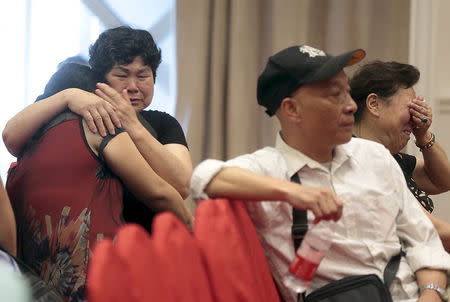 Relatives of passengers on the ship that sank at Jianli section of Yangtze River in Hubei province, cry as they wait for news at an arranged hotel, in Nanjing, Jiangsu province, China, June 2, 2015. REUTERS/Stringer