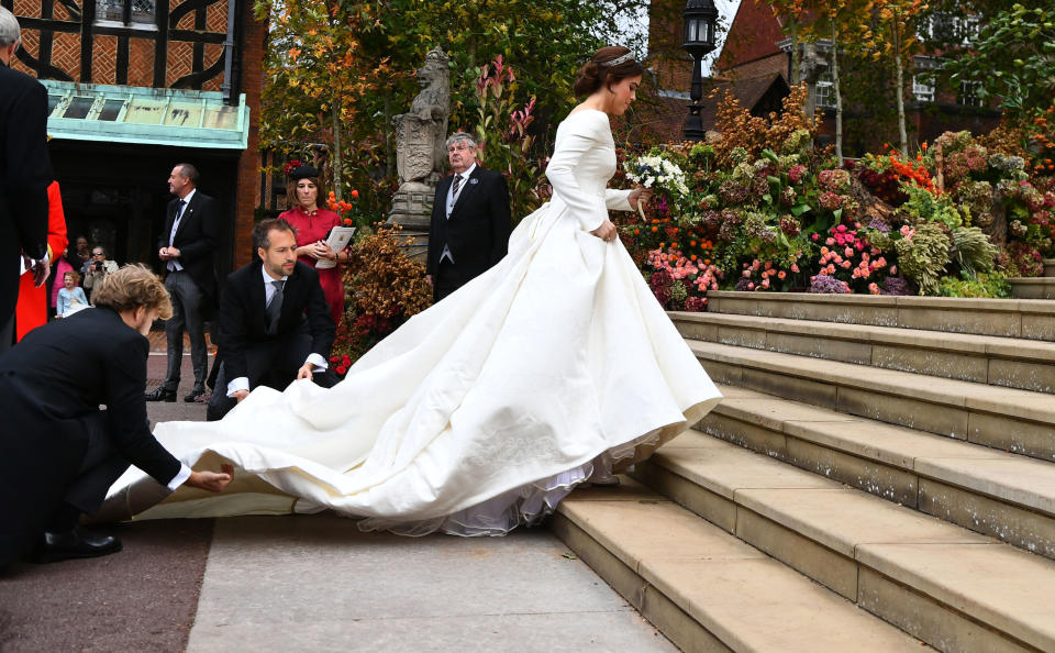 Eugenie making her way up the steps to the chapel.&nbsp;