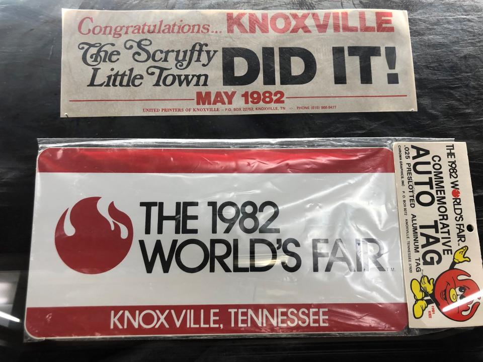 An auto plate and a sticker saying “The Scruffy Little Town Did It” are part of the 1982 World’s Fair displays at the McClung Historical Collection. July 20, 2022.