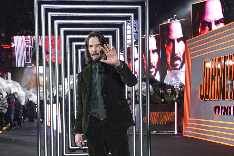 Keanu Reeves poses for photographers upon arrival at the premiere of the film 'John Wick Chapter 4', Monday, March 6, 2023 in London. (Alberto Pezzali/Invision/AP)