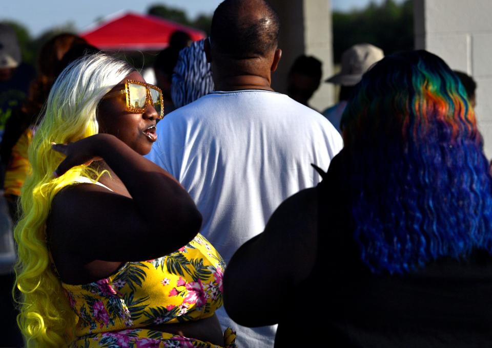 Juneteenth celebrants wait in line for a free fish fry Friday at Stevenson Park.
