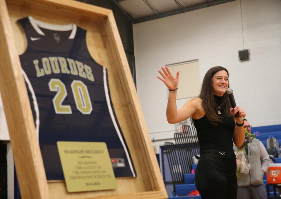 Maddy Siegrist speaks to the crowd during her jersey retirement ceremony at Our Lady of Lourdes High School on January 4, 2024.