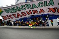 Demonstrators participate in a protest in La Paz