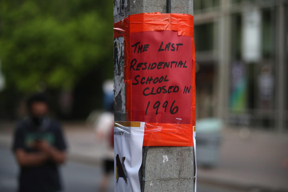 <p>A sign in downtown Toronto reads: "The last residential school closed in 1996." (Steve Russell/Toronto Star via Getty Images)</p> 