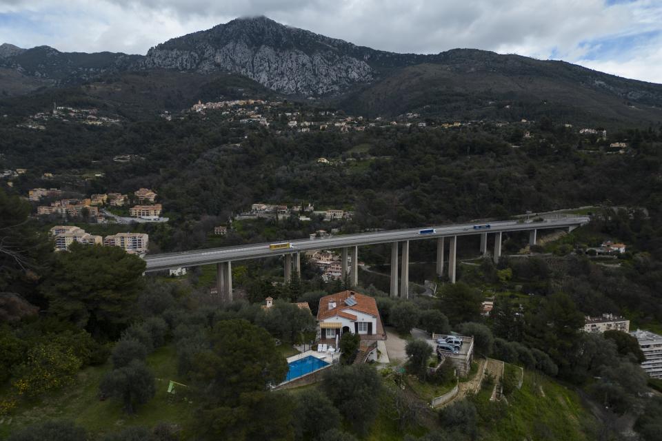 Sixth-generation lemon farmer Pierre Ciabaud's house and lemon farm sits near the highway in Menton, France, Wednesday, March 6, 2024. “The valleys of Menton used to be covered with lemon groves, there were trees everywhere,” Ciabaud said. (AP Photo/Daniel Cole)