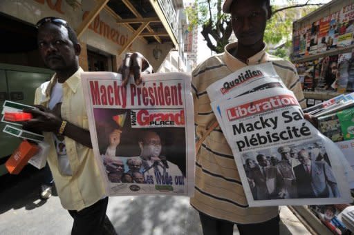 A street vendor sells Senegalese newspapers in Dakar. Senegal's Macky Sall on Monday hailed a new era after triumphing over veteran leader Abdoulaye Wade in a presidential poll lauded the world over as an example for African democracy