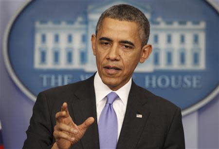 U.S. President Barack Obama holds his year-end news conference in the Brady Press Briefing Room in the White House in Washington December 20, 2013. REUTERS/Larry Downing