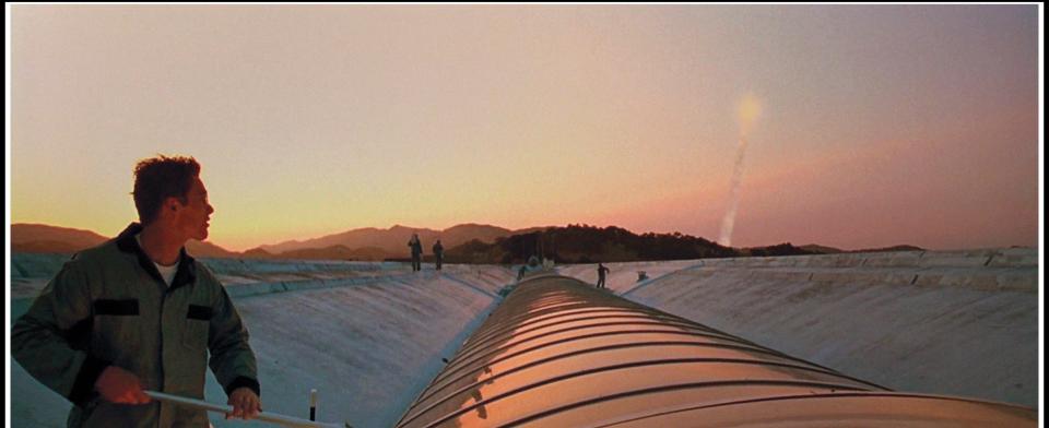 Vincent Freeman (Ethan Hawke) stands atop the Marin County Civic Center in the sci-fi film Gattaca.