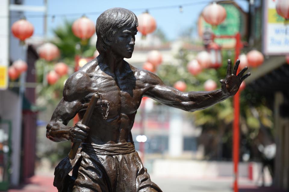 A statue of the late martial arts icon Bruce Lee is seen in Chinatown in downtown Los Angeles, June 16, 2013. / Credit: Robyn Beck/AFP via Getty Images