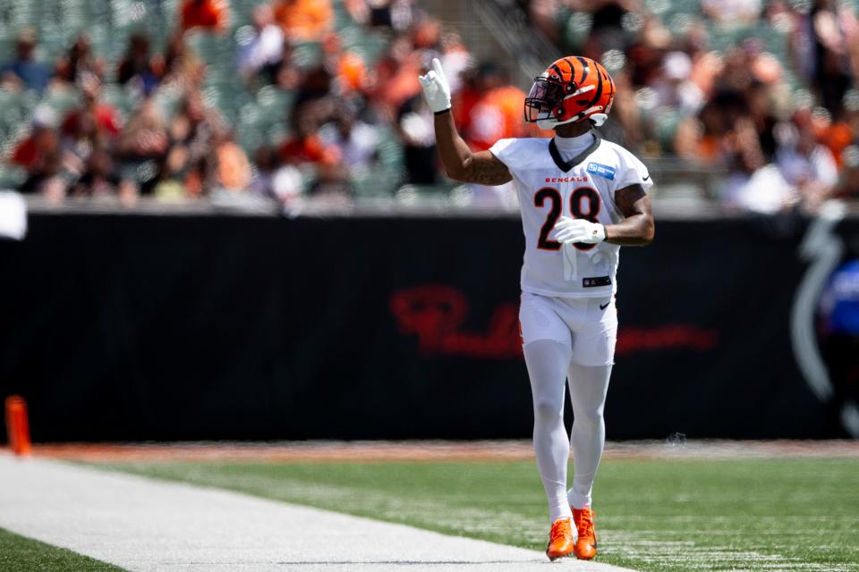 Cincinnati Bengals running back Joe Mixon (28) holds up one finger after running for a touchdown during Cincinnati Bengals preseason training camp at Paul Brown Stadium in Cincinnati on Saturday, July 30, 2022.