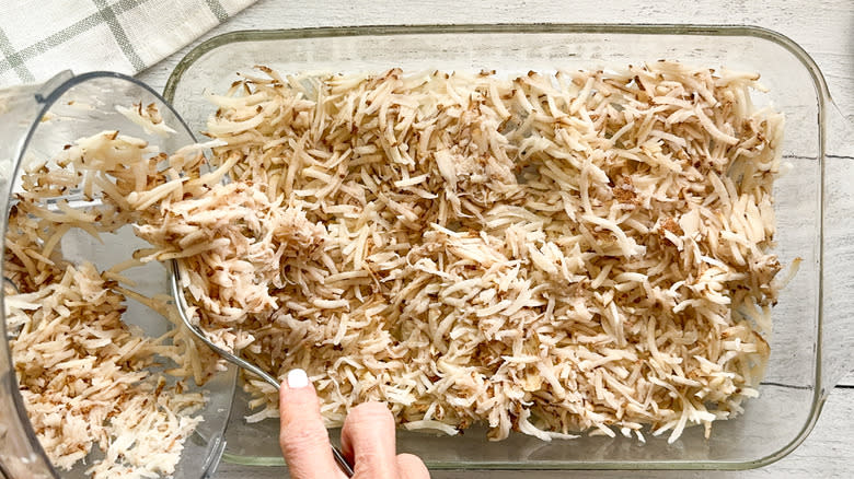 grated potatoes in baking dish