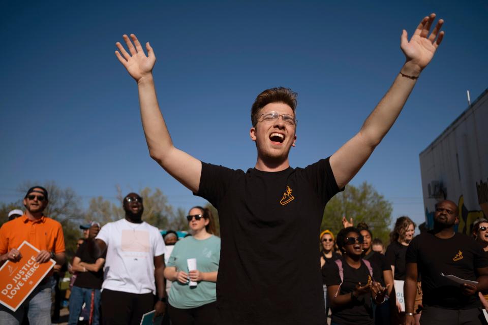 Santos Davis sings along with the band at the Dream Peace Walk in Oklahoma City from Douglass High School to the Bridge Impact Youth Center, to celebrate the anniversary of Dr. Rev. Martin Luther King, Jr's Letters from Birmingham,  Sunday, April 16, 2023.