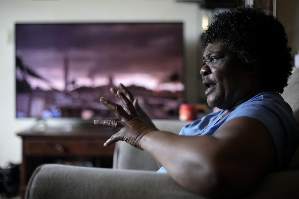 Bobbie Boyd talks about this summer's heat in her apartment Wednesday, Aug. 9, 2023, in Fayetteville, Ark. On a fixed income, Boyd sacrifices meals, health care, and car insurance among other necessities to pay rent and keep cool in the midst of this summer's prolonged heat waves. (AP Photo/Charlie Riedel)