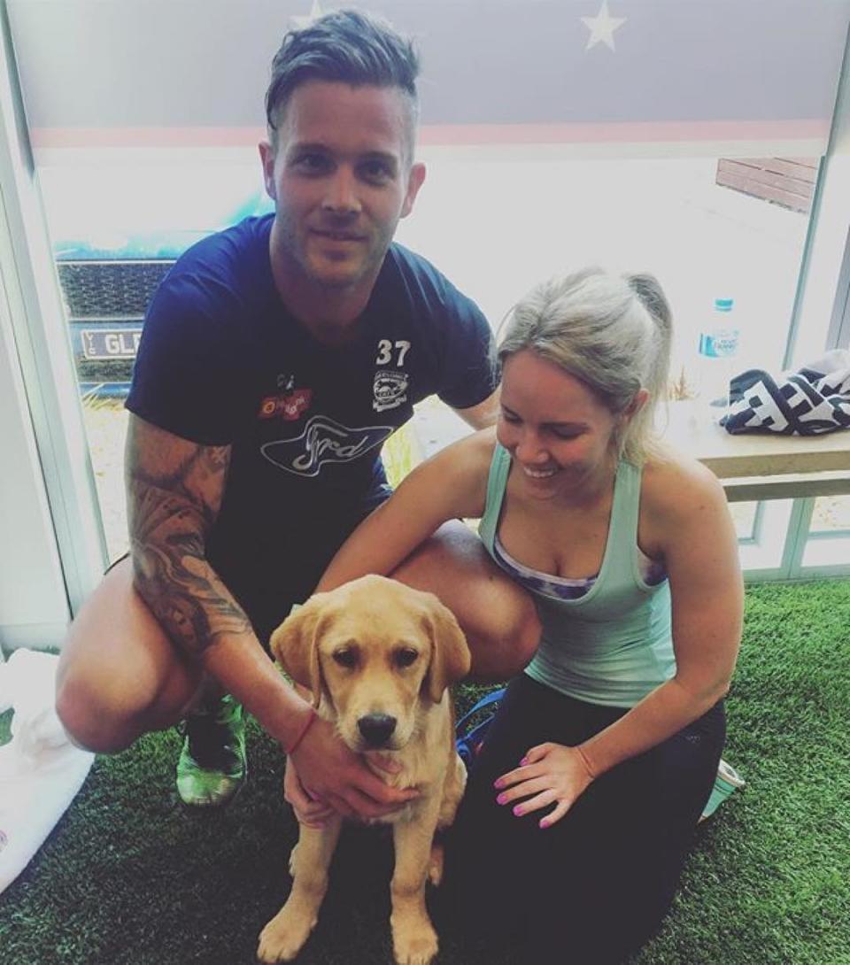 Jake Edwards and Paige McCuskey with a guide dog