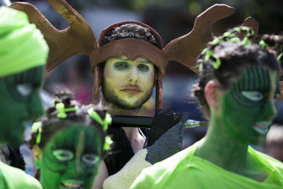 Israeli dancers take part in a parade to celebrate the Jewish holiday of Purim on March 16, 2014 in the central Israeli city of Netanya. The carnival-like Purim holiday is celebrated with parades and costume parties to commemorate the deliverance of the Jewish people from a plot to exterminate them in the ancient Persian empire 2,500 years ago, as recorded in the Biblical Book of Esther. AFP PHOTO / JACK GUEZ        (Photo credit should read JACK GUEZ/AFP/Getty Images)