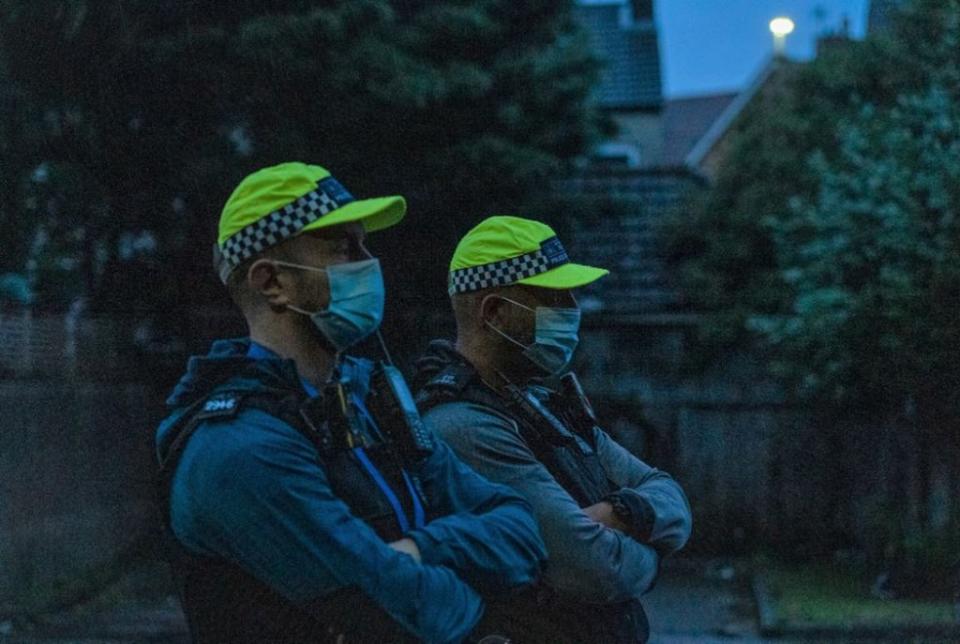 Officers at the early morning serving of a warrant for Operation Orochi to tackle county lines (Met Police) (PA Wire)