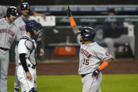 Houston Astros' Martin Maldonado (15) motions as he crosses home plant in front of Seattle Mariners catcher catcher Luis Torrens on his three-run home run during the sixth inning of a baseball game Tuesday, Sept. 22, 2020, in Seattle. (AP Photo/Elaine Thompson)