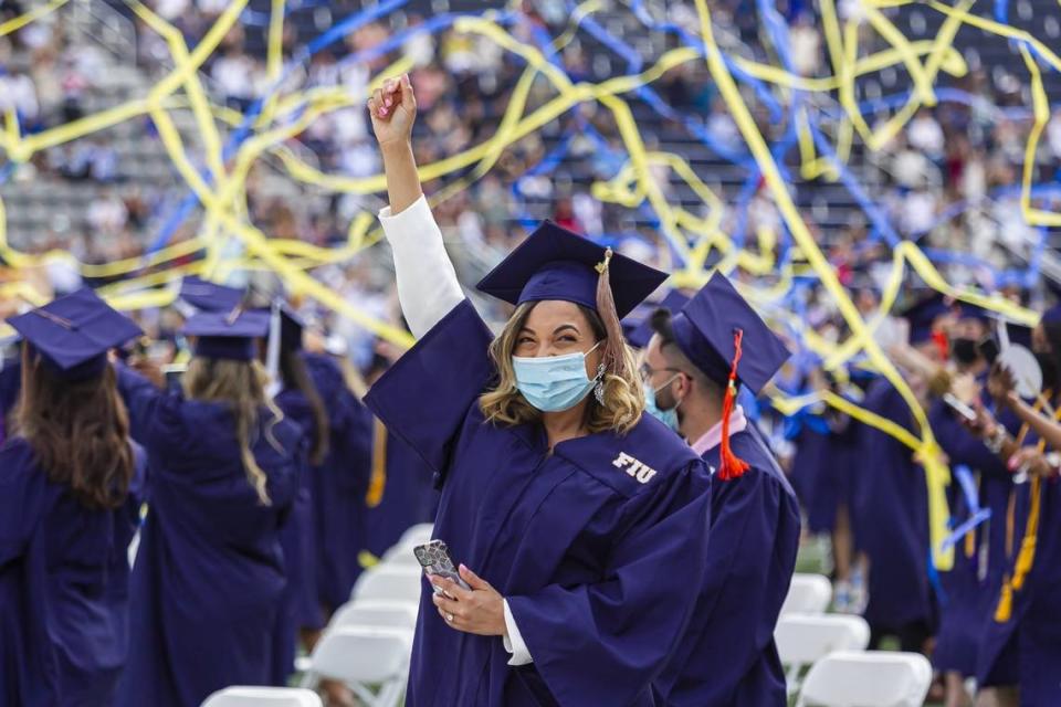 Julianny Guzman, 30, celebrates after graduating from Florida International University at the Riccardo Silva Stadium in Miami, Florida on Saturday, April 24, 2021.