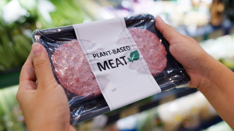 Person holding plant-based meat package