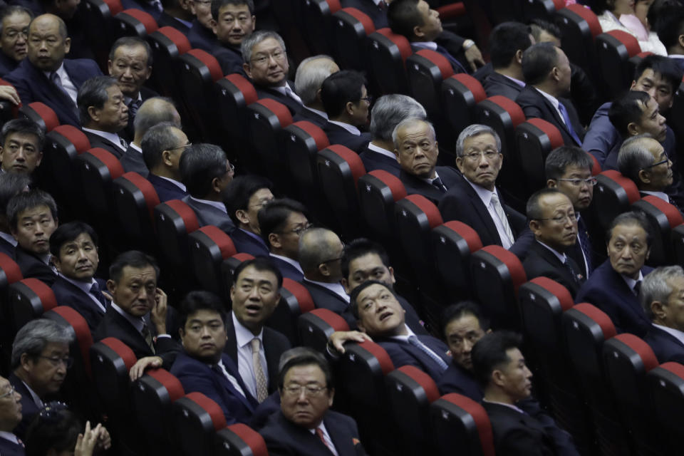 North Koreans attend an evening gala held on the eve of the 70th anniversary of North Korea's founding day in Pyongyang, North Korea, Saturday, Sept. 8, 2018. North Korea will be staging a major military parade, huge rallies and reviving its iconic mass games on Sunday to mark its 70th anniversary as a nation. (AP Photo/Kin Cheung)