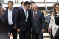 Brazilian President-elect Luiz Inacio Lula da Silva, center right, arrives at the COP27 U.N. Climate Summit, Wednesday, Nov. 16, 2022, in Sharm el-Sheikh, Egypt. (AP Photo/Peter Dejong)