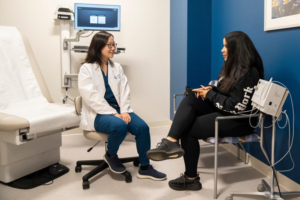 Apr 23, 2024; Paramus, NJ, United States; Dr. Yiping Xing talks with patient Nathalee Tibvrcio at Hackensack Meridian Health and Wellness Center on Tuesday afternoon.