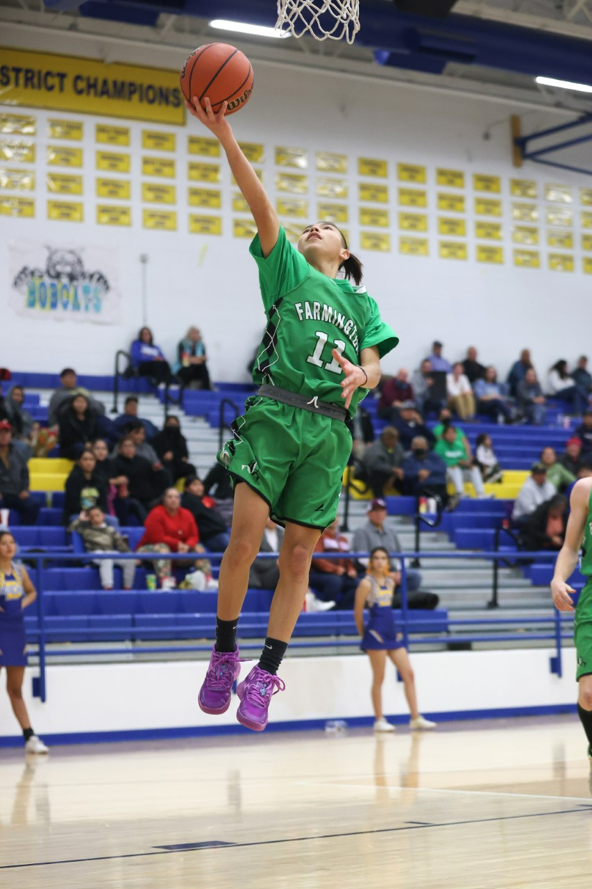 Farmington's Hayden Begay beats the Bloomfield defense and scores on a layup in the fourth quarter at Bobcat Gym on Tuesday, December 13, 2022.