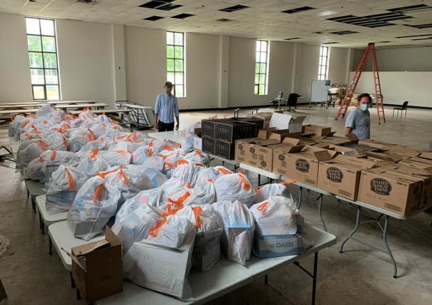 Volunteers with the New Brunswick African Association prepare and sort the food that they will then distribute to the African community in Fredericton. 