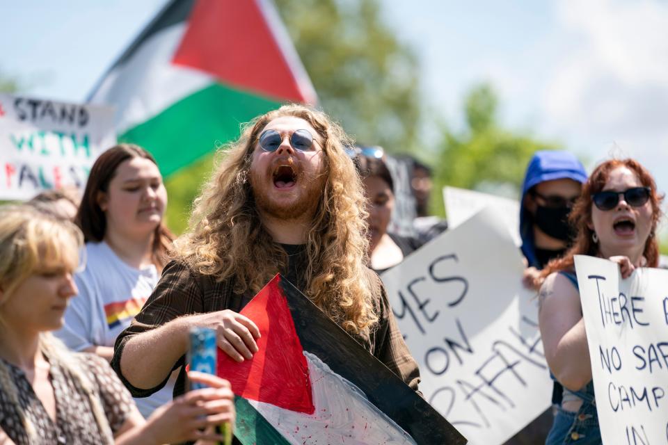 Students and members of the public gather outside the David L. Rice Library on the University of Southern Indiana campus to protest the war in Gaza in Evansville, Ind., Tuesday, April 30, 2024.