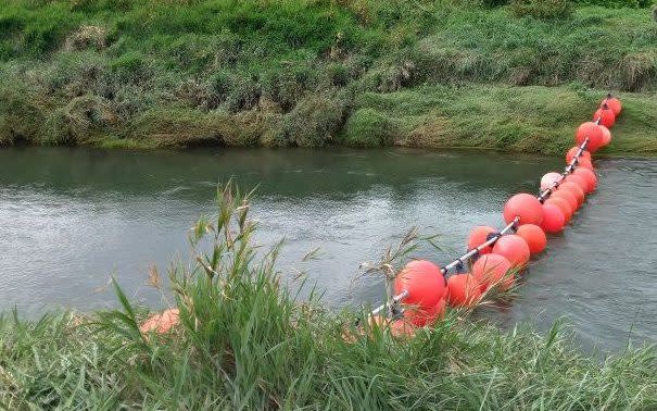 A chain of buoys across the Authie river to prevent people smugglers using 'taxi boats' along France's waterways to reach the English Channel