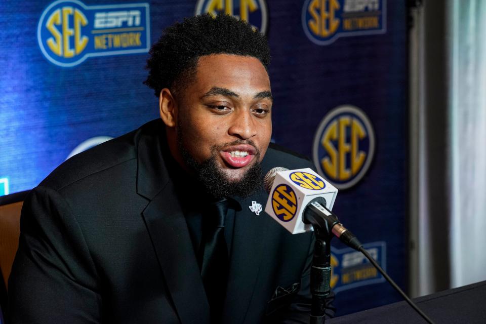 Texas A&M's Layden Robinson speaks to reporters.