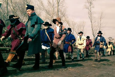 Re-enactors of the Battle of New Orleans march back to their camp from the re-created battlefield on the 200th anniversary of the battle in Chalmette, Louisiana January 8, 2015. REUTERS/Jonathan Kaminsky