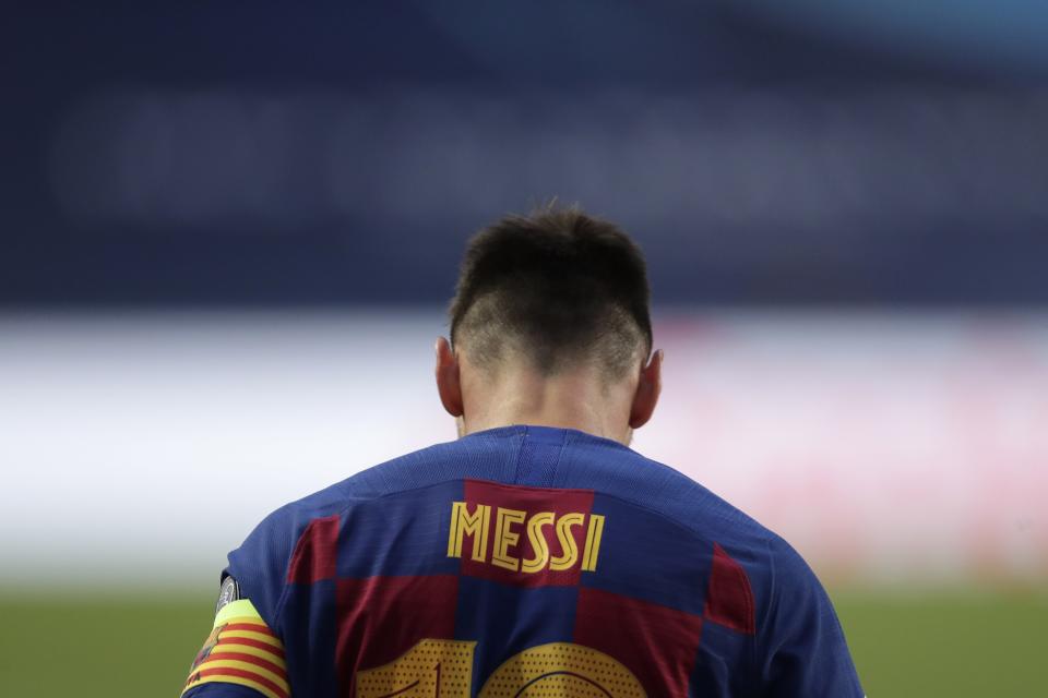 Barcelona's Lionel Messi during the Champions League quarterfinal match between FC Barcelona and Bayern Munich at the Luz stadium in Lisbon, Portugal, Friday, Aug. 14, 2020. Gerard Piqué says Barcelona "hit rock bottom" in an 8-2 humiliation from Bayern Munich in the Champions League quarterfinals. It's 74 years since Barcelona conceded eight goals in a game. (AP Photo/Manu Fernandez/Pool)