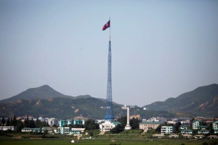 FILE PHOTO: A North Korean flag flutters on top of a tower at the propaganda village of Gijungdong in North Korea, in this picture taken near the truce village of Panmunjom, South Korea, August 26, 2017.  REUTERS/Kim Hong-Ji/File Photo