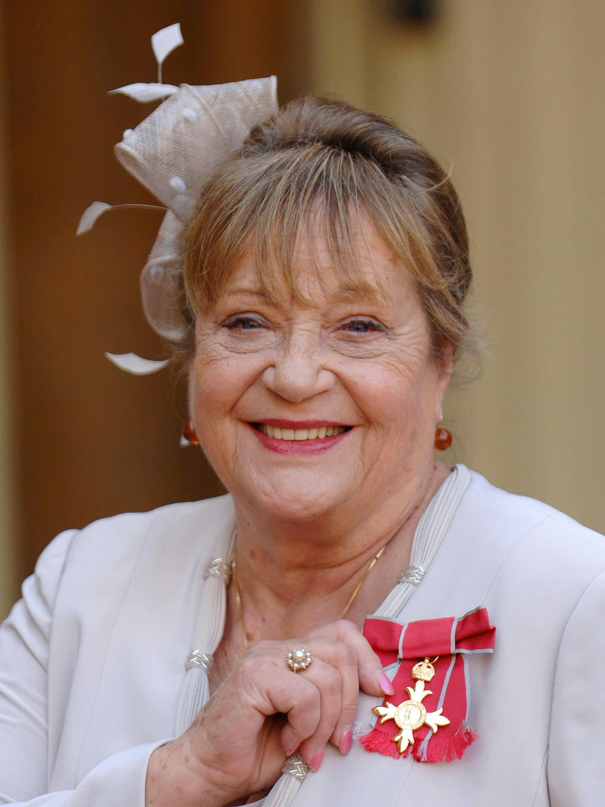 Syms pictured in 2007 after collecting her OBE (PA)
