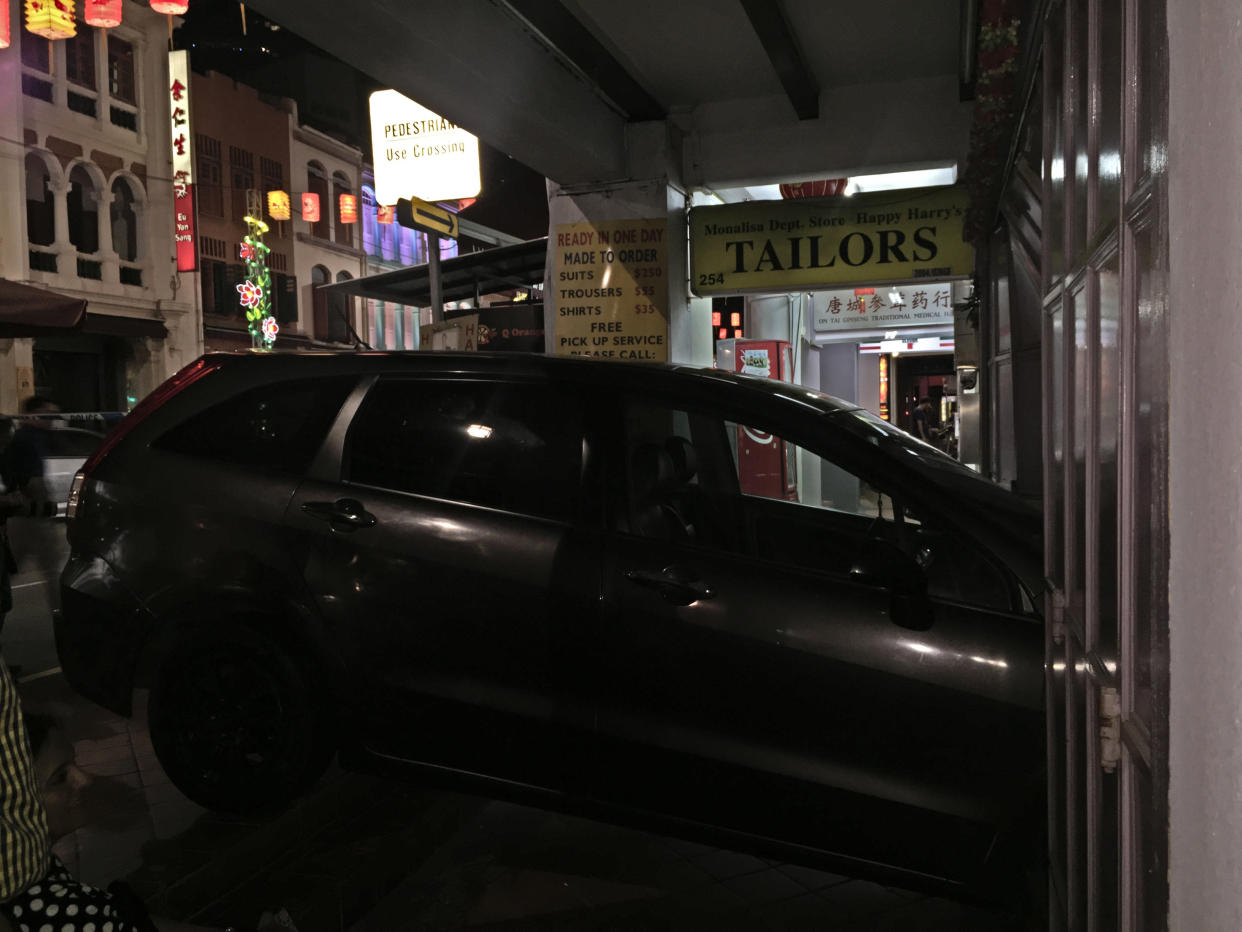 A Honda Stream ploughed into a tailor shop front on South Bridge Road after an accident with another car on 14 September 2018. (PHOTO: Teng Yong Ping/Yahoo News Singapore)