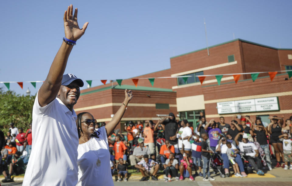 Andrew Gillum and his wife, R. Jai Gillum, at the FAMU homecoming parade.&nbsp;He&rsquo;s a Rattler, having graduated from the university in 2003. (Photo: Willie J. Allen Jr. for HuffPost)