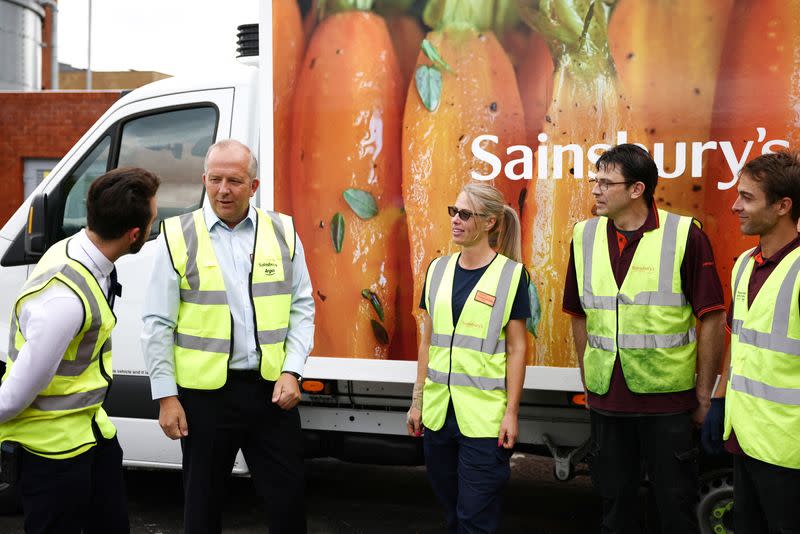 Chief Executive Officer of Sainsbury's Simon Roberts speaks to staff members inside a Sainsbury’s supermarket in Richmond