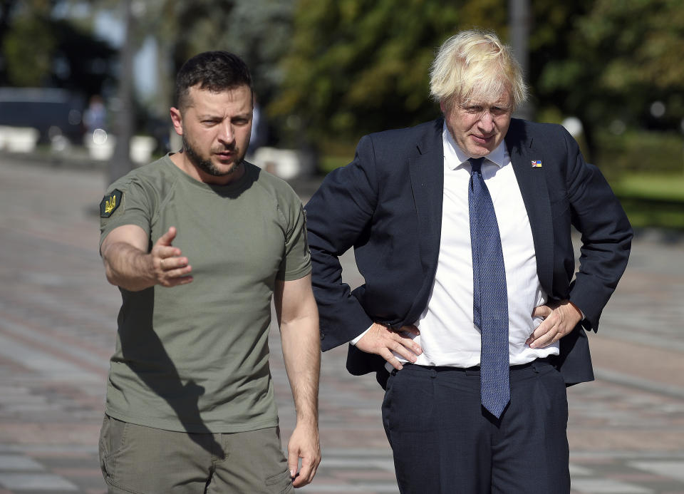 KYIV, UKRAINE - AUGUST 24, 2022 - President of Ukraine Volodymyr Zelenskyy (L) and Prime Minister of the United Kingdom Boris Johnson attend the inauguration of the plaque on the Alley of Courage in Konstytutsii (Constitution) Square outside the Verkhovna Rada building on the 31st Independence Day, Kyiv, capital of Ukraine. (Photo credit should read Ruslan Kaniuka/ Ukrinform/Future Publishing via Getty Images)